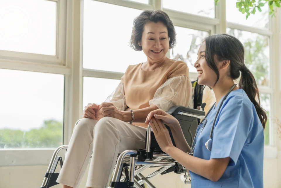 A home healthcare professional spending time with a senior client